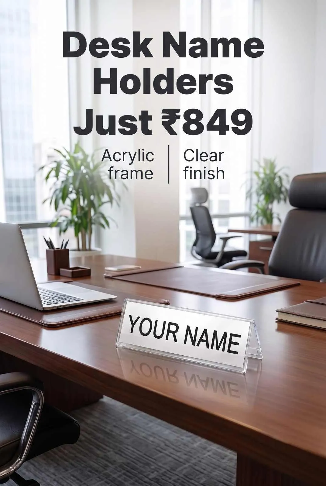 Minimalist clear acrylic slanted desk name plate holder sitting on polished wooden conference table next to laptop