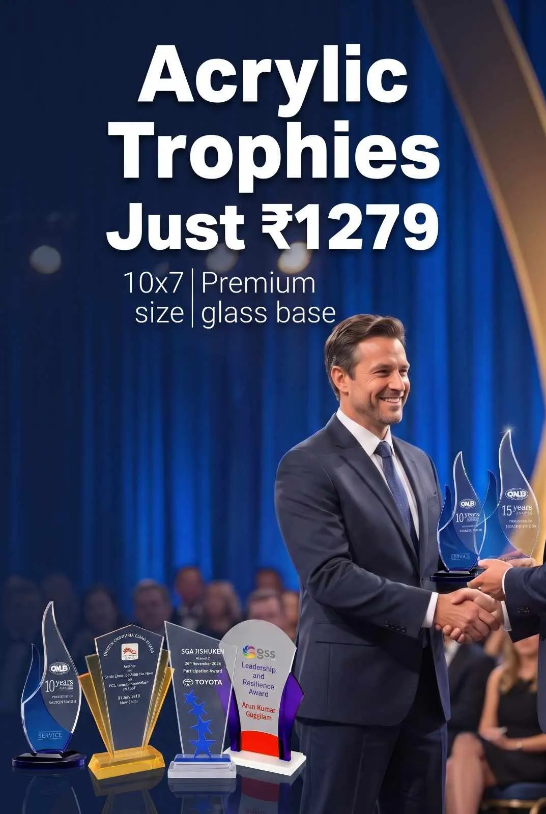 Executives congratulating recipient with flame-shaped and sail-shaped acrylic trophies set into heavy beveled glass bases